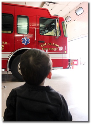 Child Watching Fire Truck