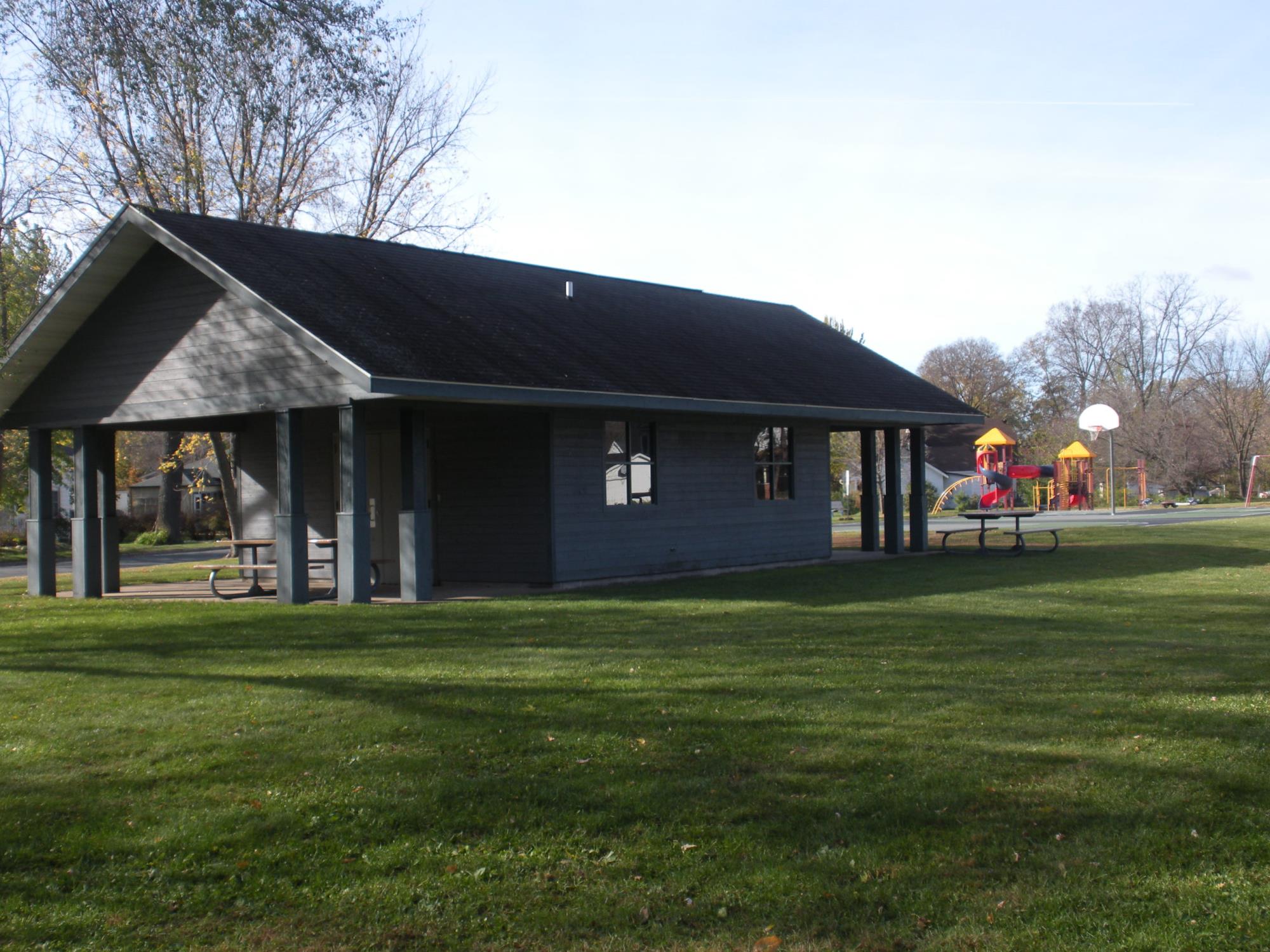 Photo of Demmler Shelter exterior with playground in background