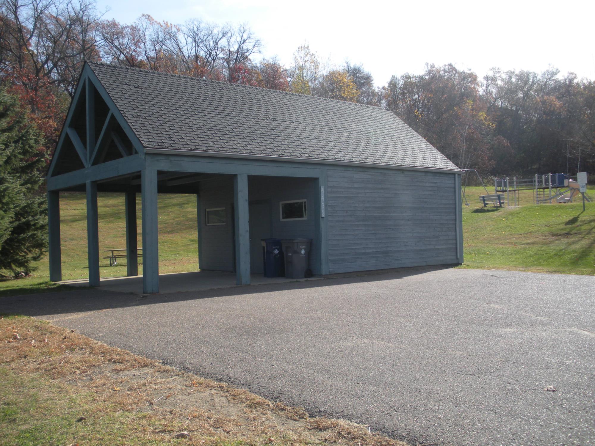 Photo of Oakwood Hills Shelter exterior with playground in background